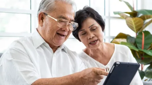 Adult couple with tablet